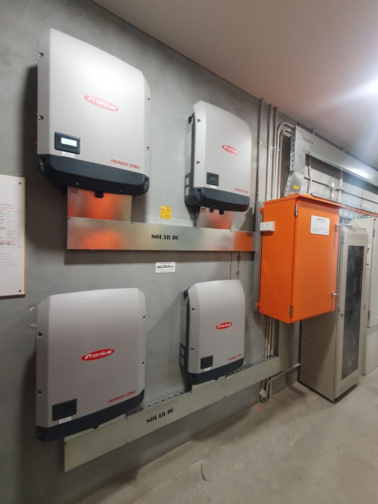 100kW solar in campbellfield fronius inverters mounted on wall for Leeda Projects factory installed by SolarVista